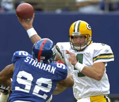 
Michael Strahan of the New York Giants pressures Green Bay's Brett Favre during an early-season game last year. Associated Press
 (Associated Press / The Spokesman-Review)