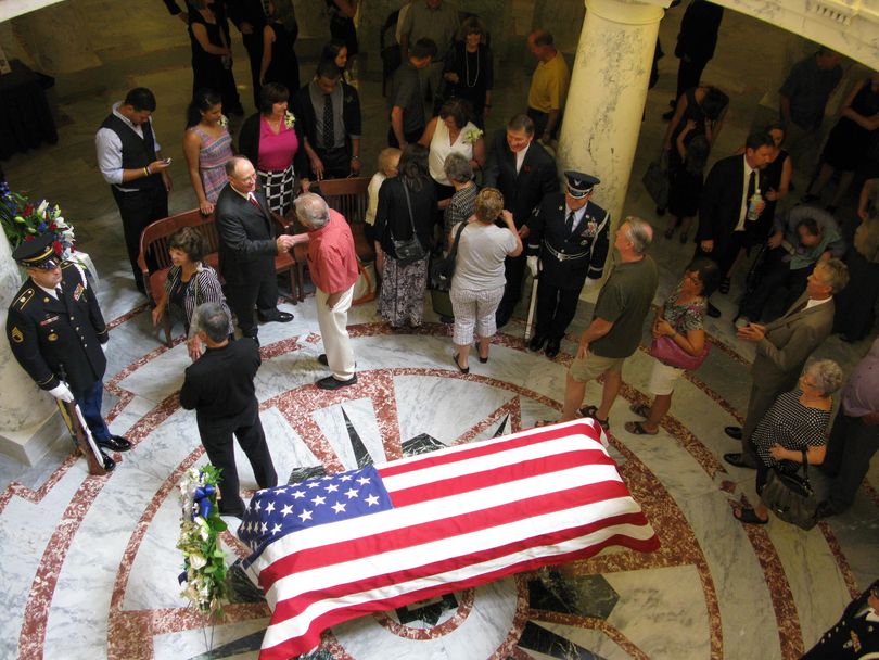 Friends and well-wishers line up to pay respects to the family of former Idaho Gov. John V. Evans, as his body lies in state in the Idaho Capitol rotunda on Friday (Betsy Russell)