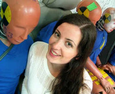 
UI graduate Laura Thackray sits amid crash-test dummies for Volvo. She works at the automotive company's safety center in Sweden designing crash-test models of pregnant women. 
 (Photo courtesy of the Volvo Safety Center / The Spokesman-Review)
