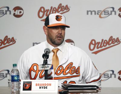 In this Dec. 17, 2018,  photo, new Baltimore Orioles manager Brandon Hyde speaks at an introductory news conference in Baltimore. There is a manager in the dugout other than Buck Showalter for the first time in nine years, and a new general manager replacing Dan Duquette, who spent seven years with the Orioles. Mike Elias, who was hired in November as Baltimores new GM, hired Brandon Hyde a month later to succeed Showalter – and the difference was obvious Tuesday, Feb. 12, 2019. There are few recognizable names, and only a handful of roster spots are accounted for. (Patrick Semansky / Associated Press)