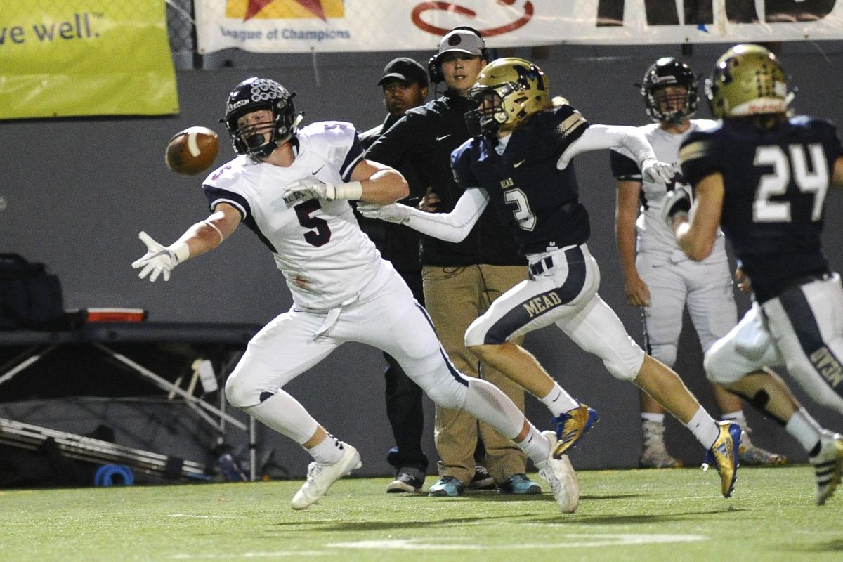 Mt. Spokane Wildcats wide receiver Tanner Brooks (5) is unable to haul in a catch against Mead Panthers defensive back Jackson Matuszeck (3) during a GSL football game, Friday, Oct. 6, 2017, at Joe Albi Stadium. (James Snook / Special to The Spokesman-Review)