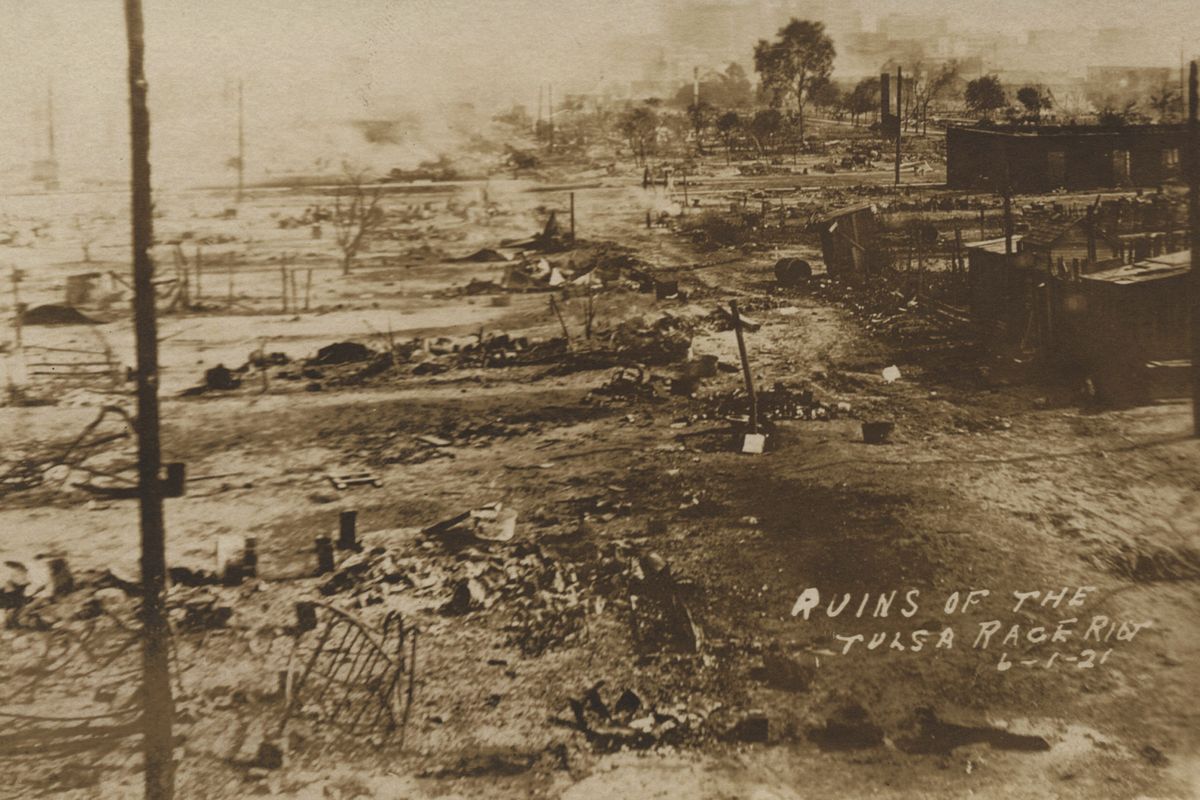 This photo provided by the Department of Special Collections, McFarlin Library, The University of Tulsa shows the ruins of Dunbar Elementary School and the Masonic Hall in the aftermath of the June 1, 1921, Tulsa Race Massacre in Tulsa, Okla.  (HONS)