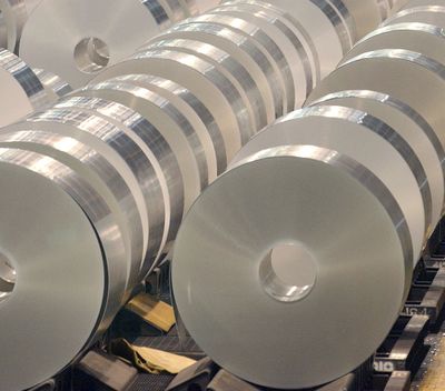 Large rolls of aluminum are cooled before they  are cut to order size at the Alcoa Warrick Operations in Newburgh, Ind.  (Associated Press)