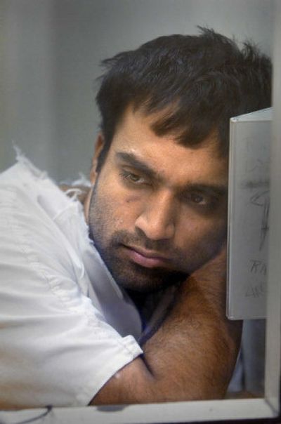 
Lance Karunaratne sits in a jail interview room during a talk about his experience with police Wednesday. Karunaratne was arrested after several cars were stolen and he was chased by police through southwest Spokane. 
 (Christopher Anderson/ / The Spokesman-Review)