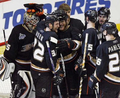 
Travis Moen (32), who scored the winning goal, and Anaheim teammates celebrate after winning Stanley Cup opener. 
 (Associated Press / The Spokesman-Review)