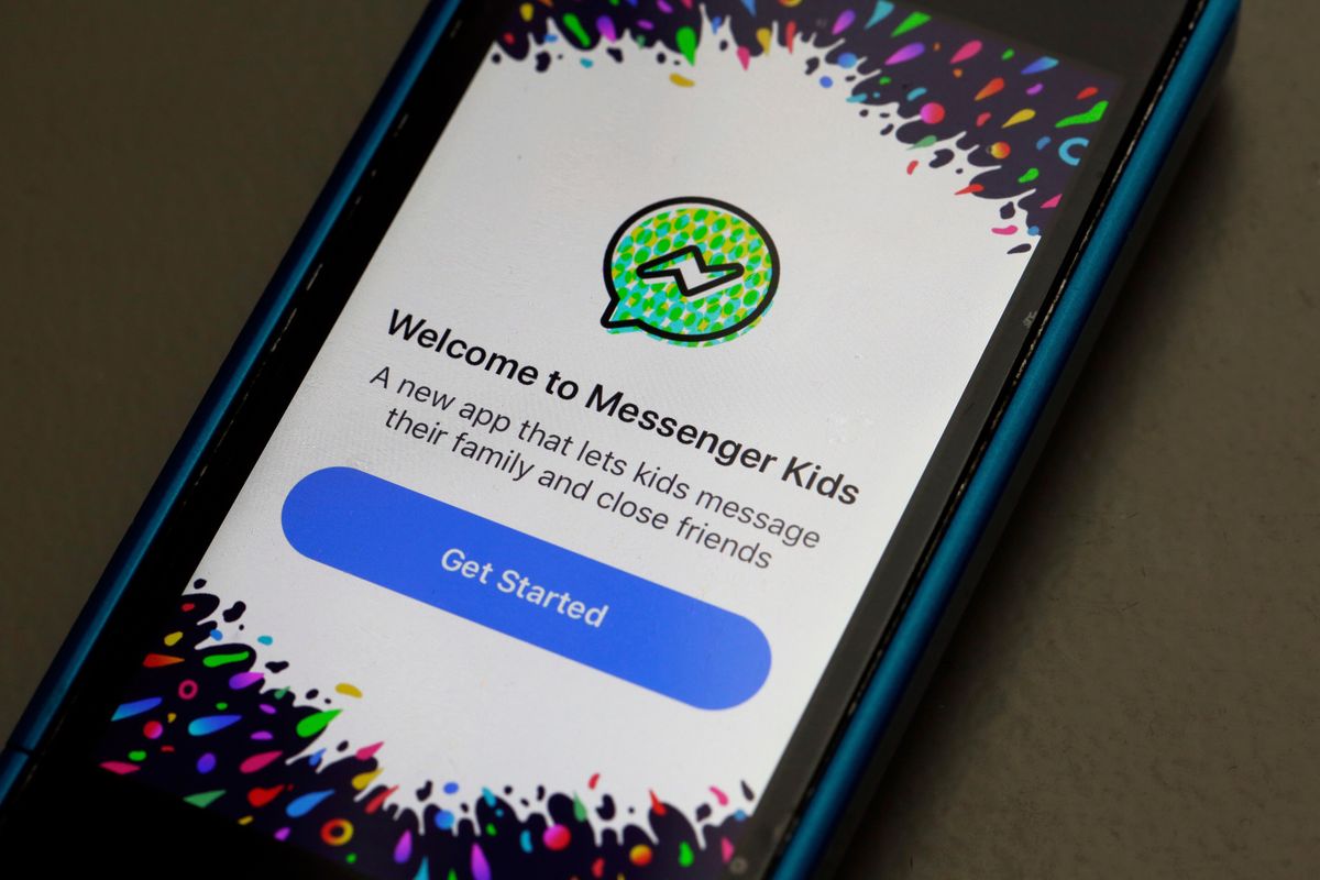 In this Feb. 16, 2018 photo, Facebook's Messenger Kids app is displayed on an iPhone in New York. The Campaign for a Commercial-Free Childhood and other groups are asking the Federal Trade Commission on Wednesday, Oct. 3, to investigate Facebook's Messenger Kids for violating the Children's Online Privacy Protection Act, or COPPA. Facebook, in the aftermath of damning testimony that its platforms harm children, will be introducing several features including prompting teens to take a break using its photo sharing app Instagram, and "nudging" teens if they are repeatedly looking at the same content that's not conducive to their well-being.  (Richard Drew)