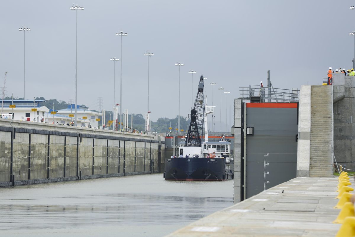 A Panama Canal Authority crane ship Oceanus, navigates the Cocoli locks during a test of the newly expanded Panama Canal locks on Pacific side, in Cocoli, Panama, Monday, June 20, 2016. The canal’s expansion project will be officially inaugurated on June 26. (Arnulfo Franco / Associated Press)