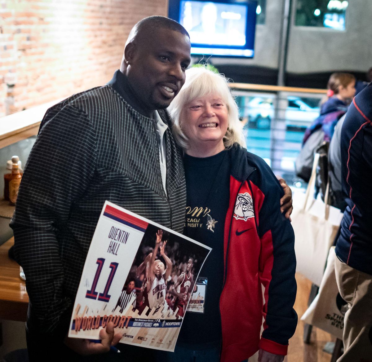 Mary Rose Hawkins has her picture taken with former Gonzaga player Quentin Hall during the VIP event before the World Court  Northwest Passages community event series  held at The Bing Crosby Theater, Mon., Nov. 4, 2019. The evening also doubled as a fundraiser to help Hall rebuild his home on Grand Bahama. (Colin Mulvany / The Spokesman-Review)