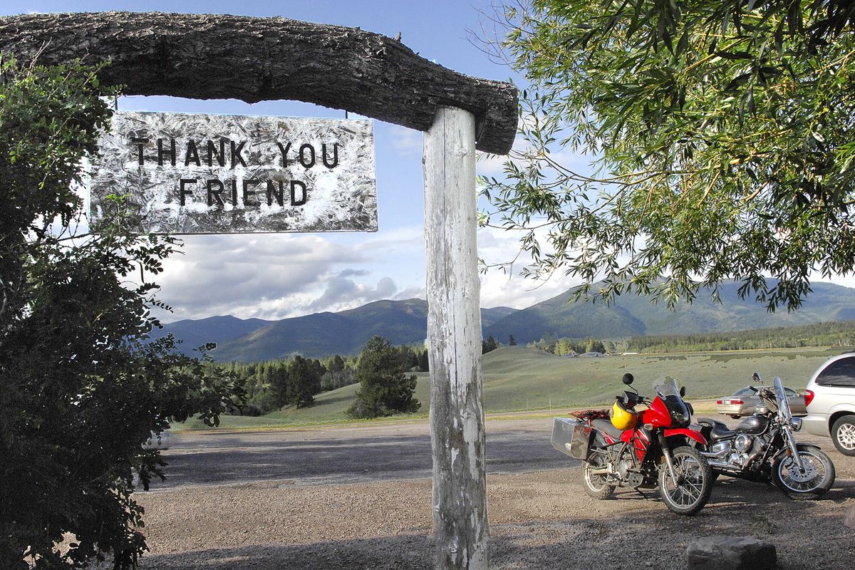 The Bob Marshall Wilderness cuts a line across the horizon as patrons leave Trixi’s Antler Saloon in 2009 in Ovando, Mont. Authorities say a grizzly bear attacked and killed a person who was camping in the area Tuesday.  (Eliza Wiley)
