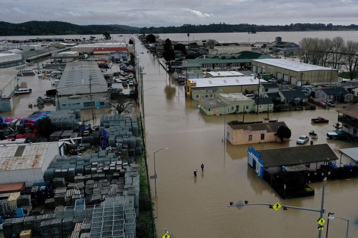 Floodwater fills the streets of Pajaro on March 13. MUST CREDIT: Washington Post photo by Melina Mara  (Melina Mara/The Washington Post)