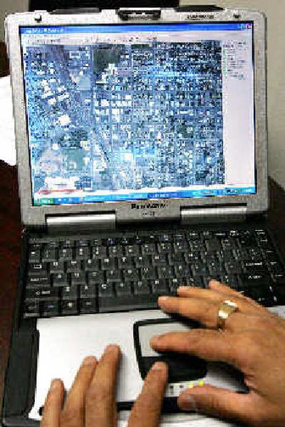 
A realtime satelite photo of downtown Hermiston, Ore., is shown on a laptop using the city's Wi-Fi cloud. 
 (The Spokesman-Review)