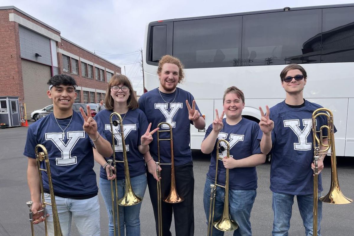 From left to right, University of Idaho band members Andre Moore, Emily Dayley, Caleb Kelsing, Camdyn Rolak and Monte Maxwell pose for a photo Friday outside the Spokane Arena before Yale beat Auburn.  (Courtesy of Andre Moore)