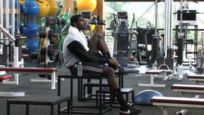
No. 1 draft pick Greg Oden works out in the Portland Trail Blazers' weight room earlier this month. Associated Press
 (Associated Press / The Spokesman-Review)