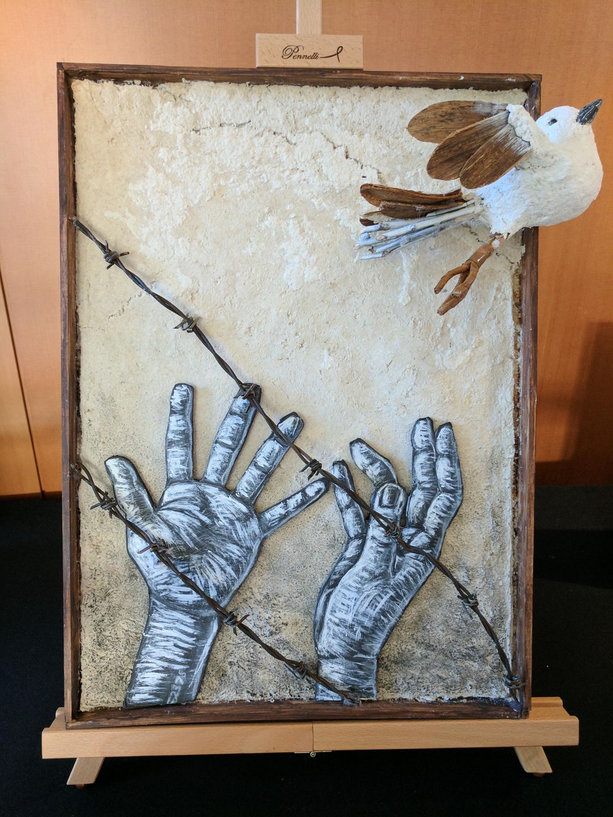 Margo Sophie Hawkins, seventh-grader at the Odyssey Program at Libby Center, won first place for “The Messenger.” Here’s her artist statement: My piece depicts a pair of hands releasing a bird, symbolic of a message being sent or the truth being spread. The bird is meant to show a desperate attempt by the oppressed to break down the walls of propaganda that had blinded the people and nations of the world. The bird was inspired by the fact that messenger pigeons were used by American soldiers in World War II. The band on its leg resembles the arm bands Jews were forced to wear in the cities as identification to the Nazis. My piece is constructed of found objects and papier-mâché. (Spokane Community Observance of the Holocaust)