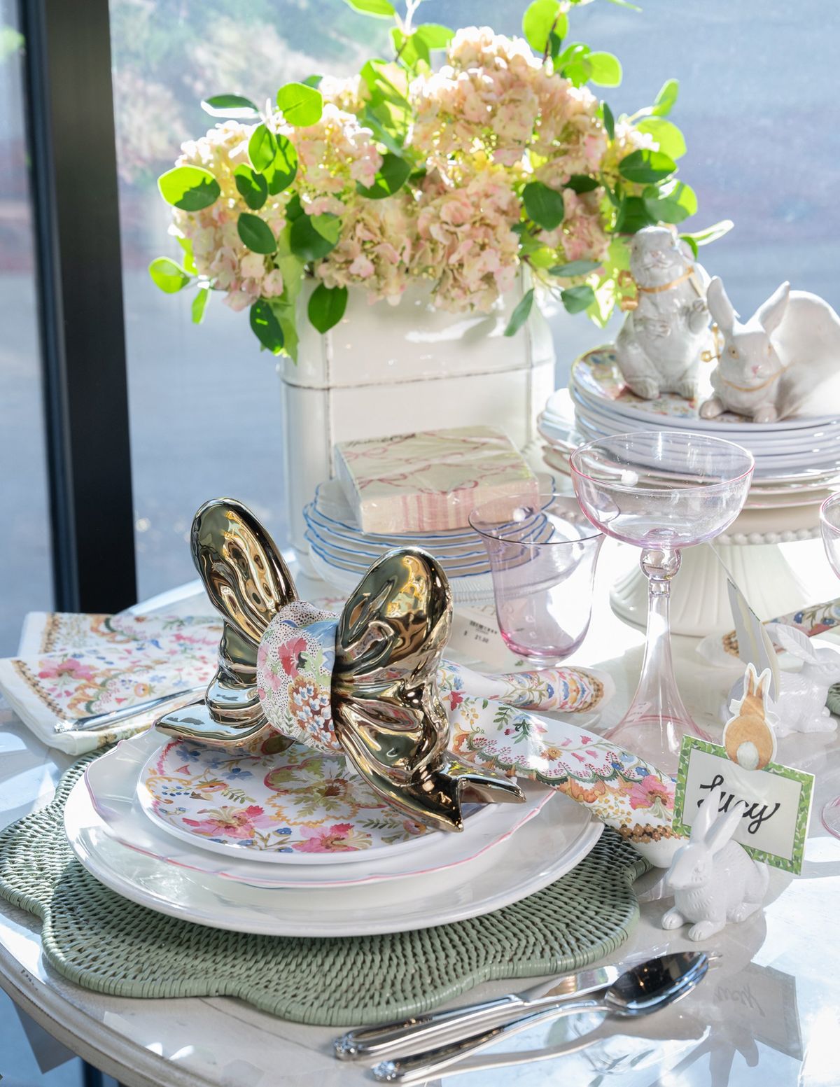 Create a whimsical and elegant Easter table with playful floral-patterned plates and matching napkins.  (Courtesy photo)