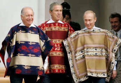 
 Were readers interested during the APEC meeting in November? President of Chile Ricardo Lagos, U.S. President George W. Bush and Russian President Vladimir Putin wear traditional Chilean ponchos as they arrive for the official APEC photograph. 
 (File/Associated Press / The Spokesman-Review)