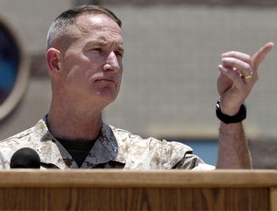 
Col. Stewart Navarre, chief of staff for Marine Corps Installations West, points to a reporter Wednesday in San Diego during a news conference about murder charges for eight U.S. servicemen.
 (Associated Press / The Spokesman-Review)