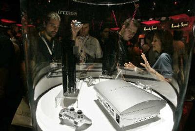 
Traders view Sony's PlayStation 3 gaming console at the Electronic Entertainment Expo on Wednesday in the Los Angeles Convention Center. 
 (Associated Press / The Spokesman-Review)