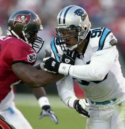 
Carolina's Julius Peppers, right, has tested offensive linemen since his rookie season of 2002. 
 (File/Associated Press / The Spokesman-Review)