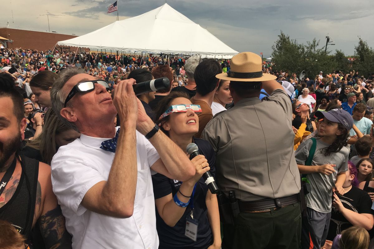 Bill Nye “the Science Guy” and astronomer Amy Mainzer during totality at a public viewing event put on by the National Park Service in Beatrice, Neb., for the 2017 solar eclipse.  (The Planetary Society/The Planetary Society)