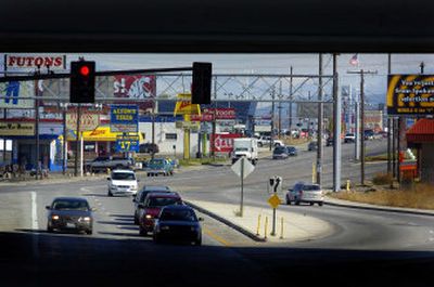 
The Interstate 90 overpass at Sprague Avenue frames the split of Sprague into the Appleway couplet. A mass of street and business signs mark the last advertising chance for businesses to hit eastbound traffic before the road splits. 
 (Christopher Anderson/ / The Spokesman-Review)