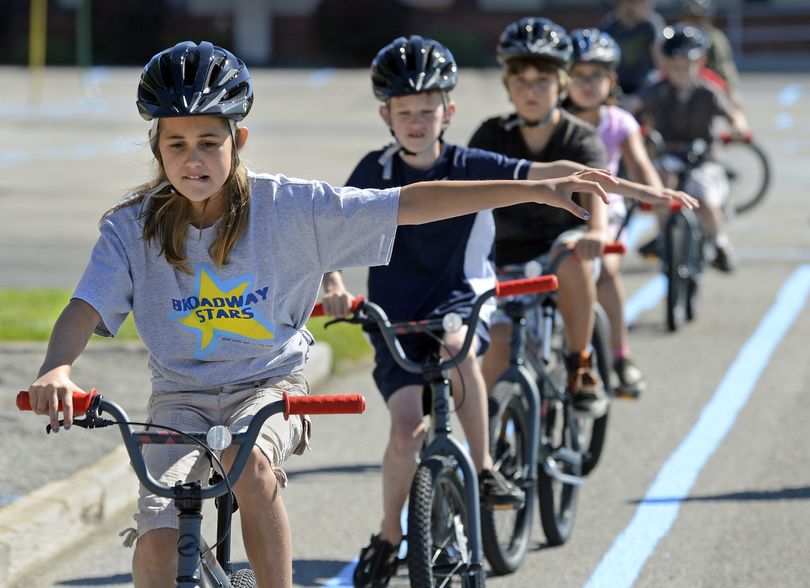 After receiving a delivery of 30 children’s bicycles from the Bike Hub, Micah Reed, 10, and other Broadway Elementary School students test out the bikes during Central Valley School District’s Elementary Bicycle Safety Program at Broadway, Aug. 30. The school’s PE teacher, Katie Ferris, secured a grant for $6,100 from SpokeFest to purchase the bikes. (Dan Pelle)