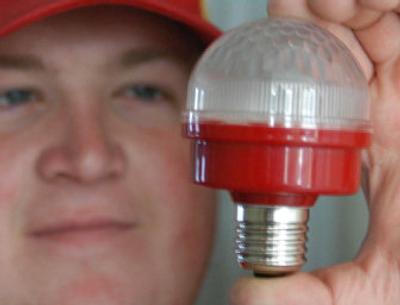
Mack Malone, of Salisbury, Md., holds his customized light-emitting diode (LED) bulb earlier this year. Smaller than conventional lighting sources, LED bulbs can produce about the same light output at a fraction of the cost. Cool to the touch, the bulbs can operate 24 hours a day, 7 days a week and last about 5 years. 
 (AP / The Spokesman-Review)