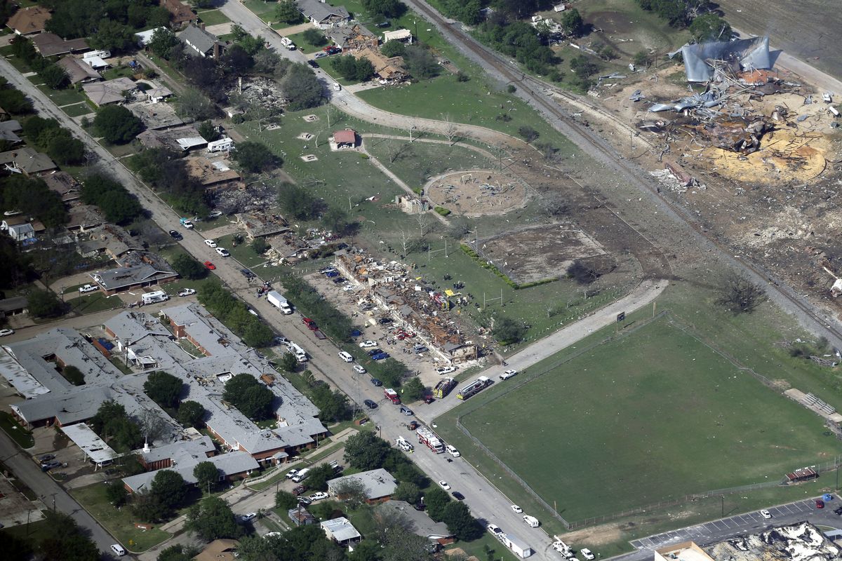 FILE - This April 18, 2013 aerial file photo, shows the remains of a nursing home, left, apartment complex, center, and fertilizer plant, right, destroyed by an explosion at a fertilizer plant in West, Texas. Images of a massive explosion in the Lebanese capital looked depressingly familiar to West, Texas Mayor Tommy, whose small town in 2013 was partly leveled by one of the deadliest fertilizer plant explosions in U.S. history. "I don't know what people were thinking about storing that stuff," Muska said, Wednesday, Aug. 5, 2020.  (Tony Gutierrez)