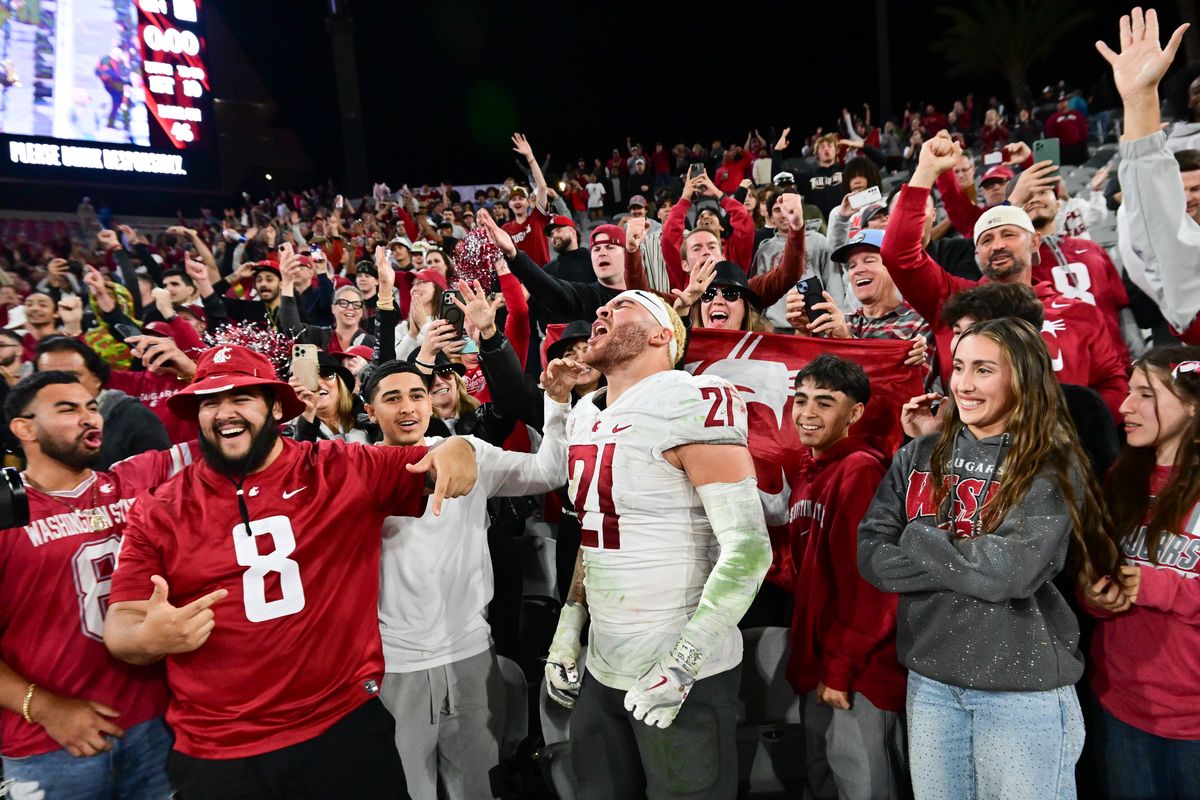 Washington State Cougars linebacker Keith Brown (21) cheers with WSU fans after WSU defeated the San Diego State Aztecs during the second half of a college football game on Saturday, Oct. 26, 2024, at Snapdragon Stadium in San Diego, Calif. WSU won the game 29-26.  (Tyler Tjomsland/The Spokesman-Review)