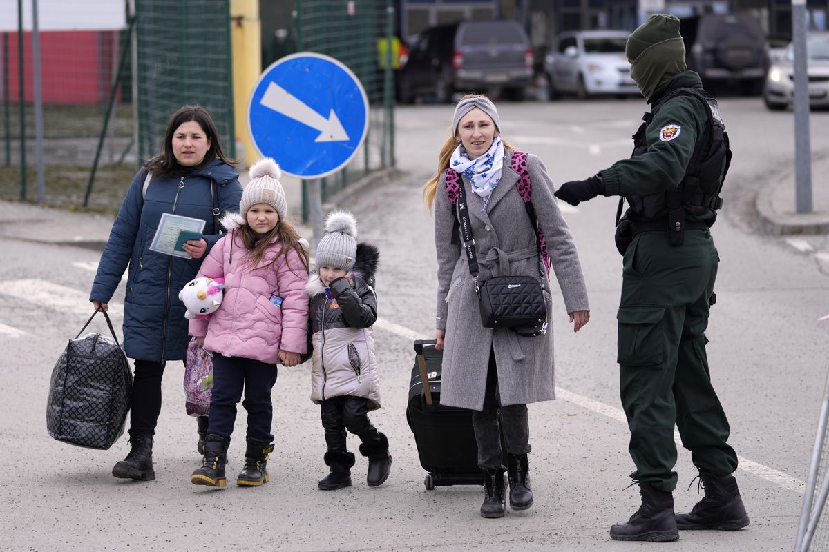 Refugees arrive from Ukraine at the border crossing Vysne Nemecke, Slovakia, Tuesday, March 1, 2022.  (Darko Vojinovic)