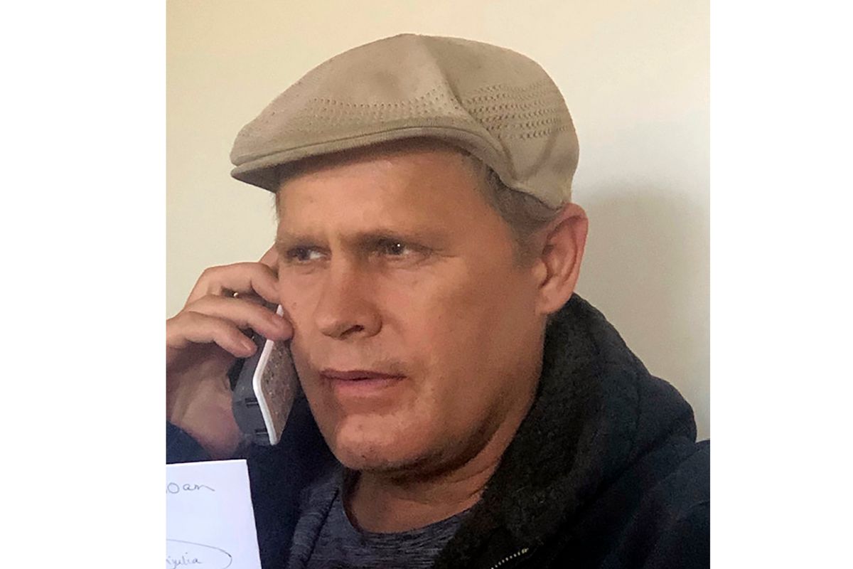 In this photo provided by Vedanta Griffith, Joshua Spriestersbach talks on a phone in Danby, Vermont on March 2020. The Hawaii Innocence Project says Spriestersbach was wrongfully arrested for someone else