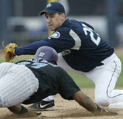 
Bret Boone of the Seattle Mariners tags out Luis Terrero of the Diamondbacks Saturday.
 (Associated Press / The Spokesman-Review)
