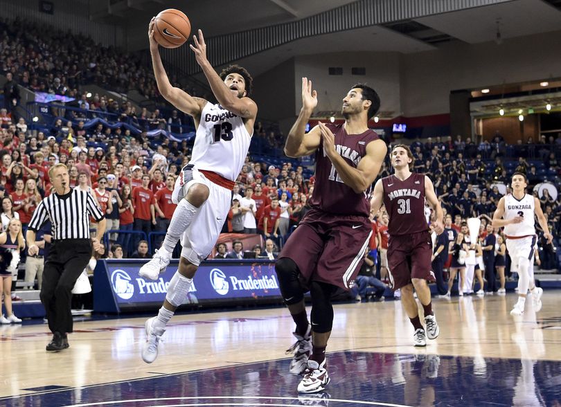 Gonzaga guard Josh Perkins (13) drives to the hoop against Montana during the first half of a college basketball game on Tuesday, Dec 8, 2015, at McCarthey Athletic Center in Spokane, Wash. (Tyler Tjomsland / The Spokesman-Review)