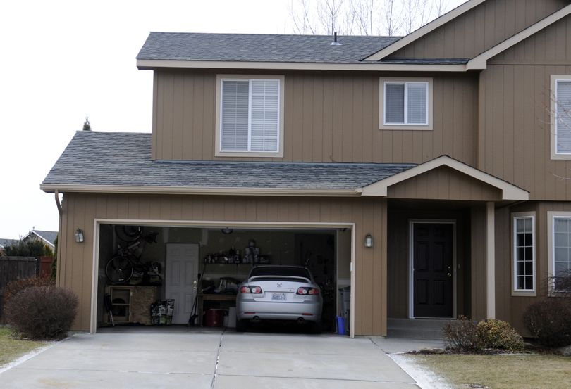 A wide-open garage like this one in Liberty Lake is an almost irresistible opportunity to burglars, police say. (J. Bart Rayniak)