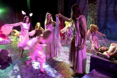 The fairies dance around Titania played by Rebecca Thompson,17, and Oberon, played by Teko Dumoulin,17, in the Stage Door to the Future production of