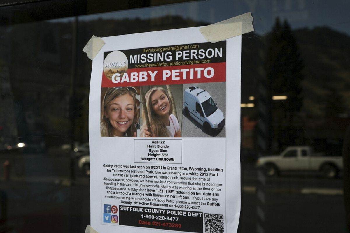 This Thursday, Sept. 16, 2021, photo, shows a Suffolk County Police Department missing person poster for Gabby Petito posted in Jakson, Wyo. Petito, 22, vanished while on a cross-country trip in a converted camper van with her boyfriend. Authorities say a body discovered Sunday, Sept. 19 in Wyoming, is believed to be Petito.  (Amber Baesler)