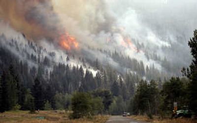 
Flames and smoke, a combination of a back-burn and the main fire, fill the hills above the Warm Springs area of Ketchum, Idaho, on Aug. 30. The Castle Rock fire was contained Sept. 4, but not before the 78-square-mile blaze forced evacuations of more than 2,000 homes.Associated Press
 (File Associated Press / The Spokesman-Review)