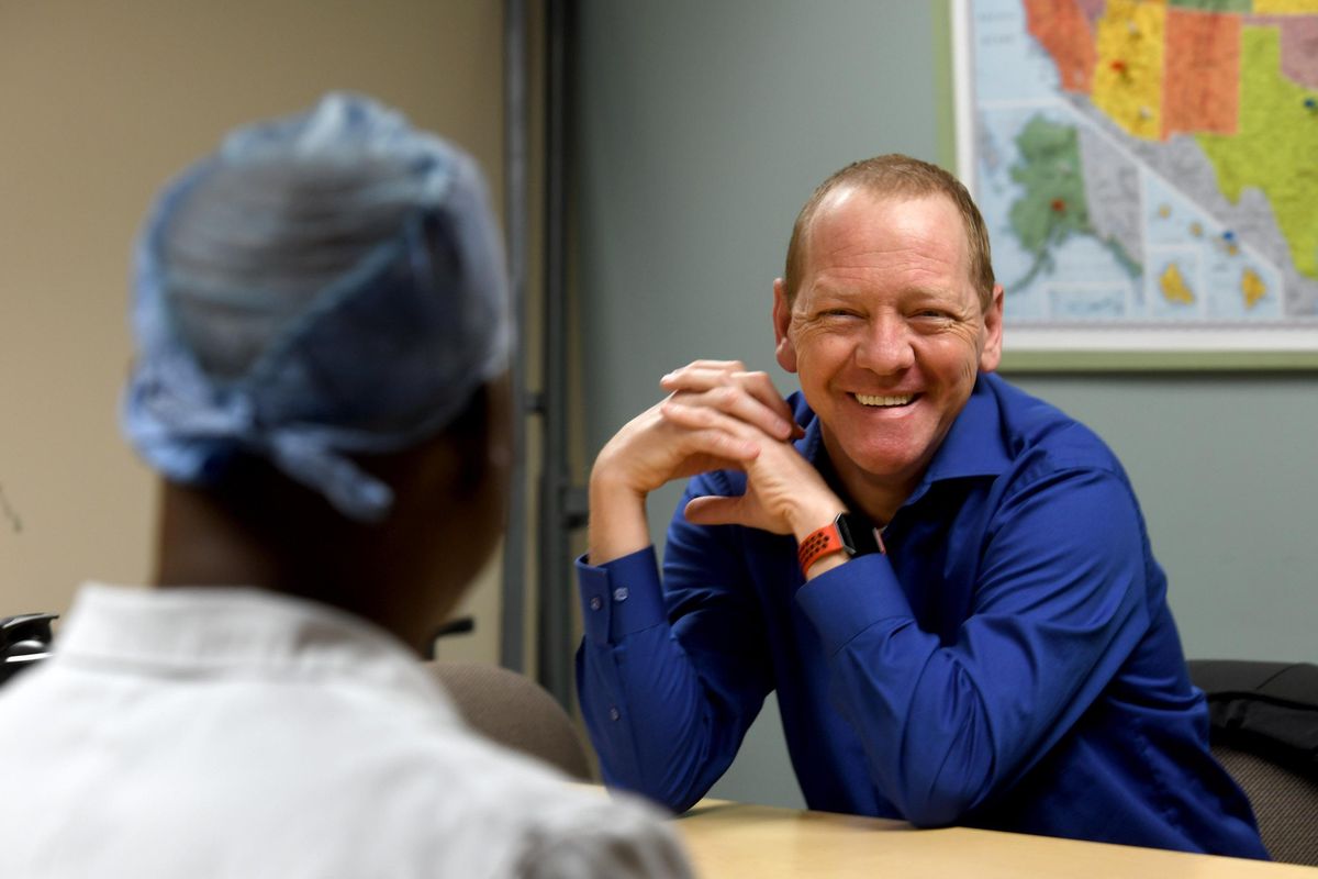 Donald White, the first recipient of a dual pancreas/kidney transplant at Sacred Heart smiles at Dr. Okechukwu N. Ojogho, surgical director for abdominal organ transplantation and transplant surgeon as they talk about the success of the experience on Monday, Feb. 12, 2018. (Kathy Plonka / The Spokesman-Review)