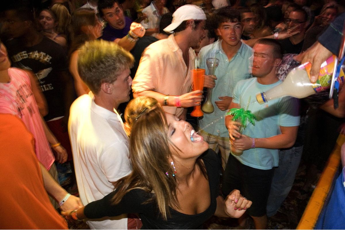 A spring break reveler gets a swig of margarita in the resort city of Cancun, Mexico. Although not nearly as dangerous as border towns, Mexico’s resort towns such as Cancun struggle with crimes against people. Officials say it’s important to travel in pairs or groups, and be aware of surroundings.  (File photos Associated Press)