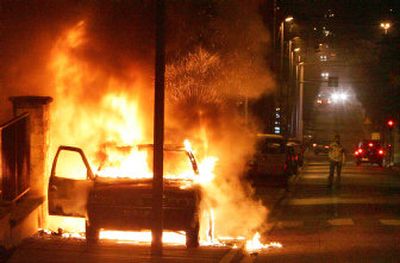 
A car burns in Pierrefitte, north of Paris, early today on the ninth day of unrest in Paris suburbs. Vehicles and buildings were torched by youths in largely immigrant areas who began rampaging after two of their peers were electrocuted last week at a power substation while hiding from police.
 (Associated Press / The Spokesman-Review)