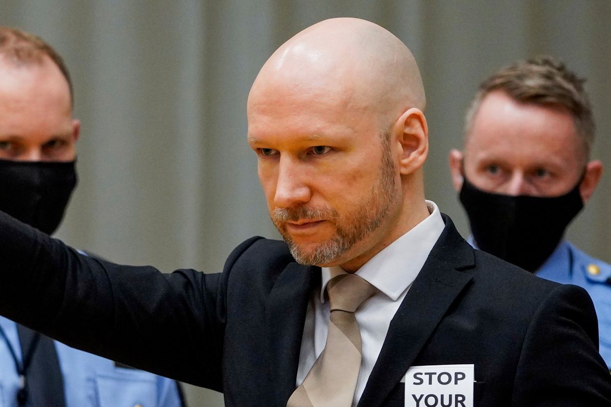 Norwegian mass killer Anders Behring Breivik arrives Tuesday in court on the first day of a hearing where he is seeking parole, in Skien, Norway.  (Ole Berg-Rusten)