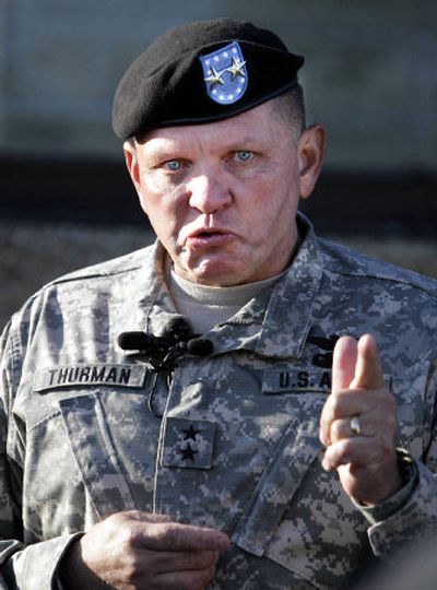 
Army Major Gen. James Thurman fights back tears as he talks to soldiers of the 4th Infantry Division at Fort Hood, Texas, Friday about their redeployment to Iraq. The current U.S. troop level in Iraq – 161,000 – is the highest of the war.
 (Associated Press / The Spokesman-Review)