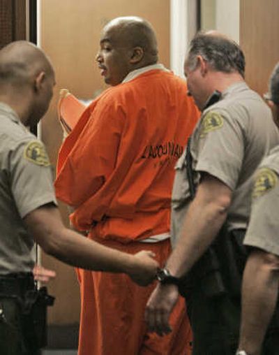 
Los Angeles County sheriff's deputies escort Chester Turner out of court after he was sentenced to death  Tuesday in  Los Angeles for the slayings of 10 women and an unborn fetus. Associated Press
 (Associated Press / The Spokesman-Review)
