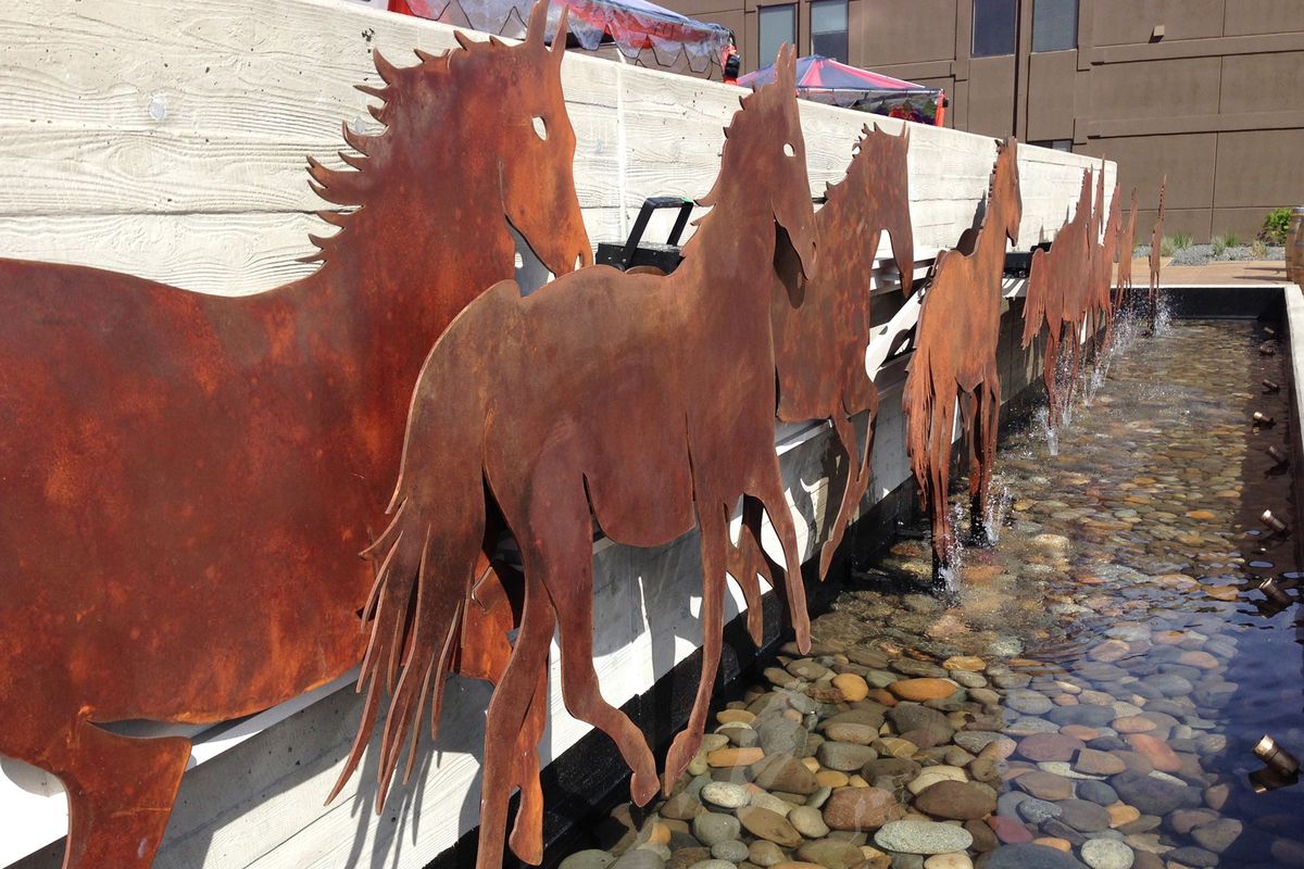 Metal sculptures of wild horses greet visitors to 14 Hand Winery in Prosser, Wash. (Andy Perdue)