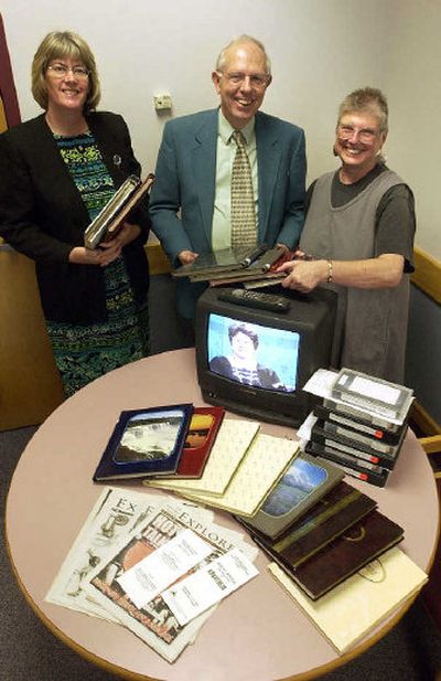 
North Idaho College instructor Tony Stewart, center, is working with NIC librarians Ann Johnston, left, and Denise Clark, right, to put his entire collection of memorabilia from the local human rights movement into the NIC libarary's special collections. 
 (Jesse Tinsley / The Spokesman-Review)