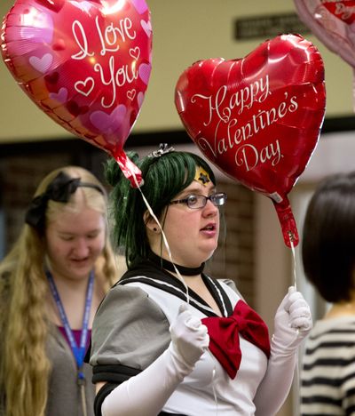Character-driven: Brianne Leep dresses as anime character Eternal Sailor Pluto as she tries to sell balloons, candy and red roses during the Spokane Falls Community College Anime Club Valentine’s rose sale Thursday in the school’s student building. The club is trying to raise money for a trip to Seattle to attend a convention. (Dan Pelle)