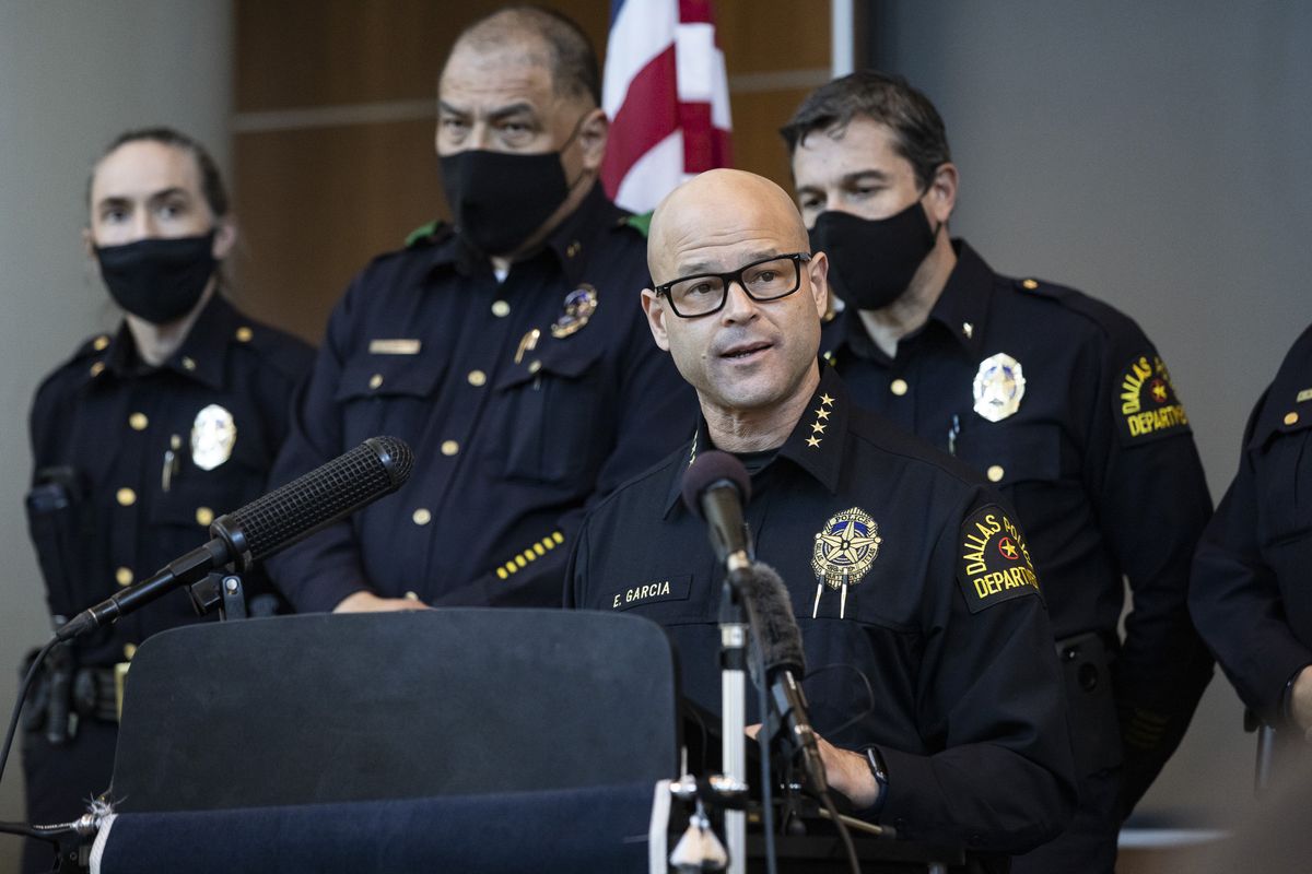 Chief Eddie García, center, speaks with media during a press conference regarding the arrest and capital murder charges against Officer Bryan Riser at the Dallas Police Department headquarters on Thursday, March 4, 2021, in Dallas. Riser was arrested Thursday on two counts of capital murder in two unconnected 2017 killings that weren