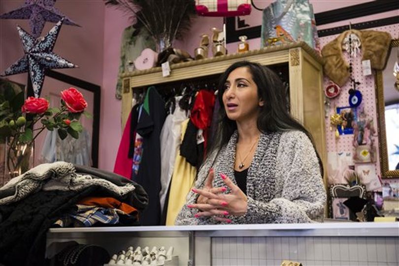 Liyah Babayan talks to a reporter in her boutique in Twin Falls, Idaho. The former refugee from Azerbaijan, now a U.S. citizen, said the recent arguments against accepting refugees are just a mask for a minority group to peddle racism and fear. (AP / Otto Kitsinger)