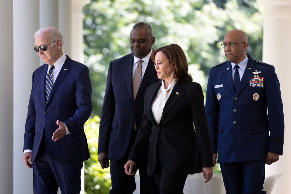 Above: From left, President Joe Biden, Defense Secretary Lloyd Austin, Vice President Kamala Harris and U.S Air Force Chief of Staff Gen. Charles Brown walk to the Rose Garden at the White House, in Washington, D.C., on Thursday. Left: President Biden shakes hands with U.S. Air Force Chief of Staff Gen. Charles Brown at the White House on Thursday. Biden announced Brown as his pick for the next Chairman of the Joint Chiefs of Staff.  (TOM BRENNER)
