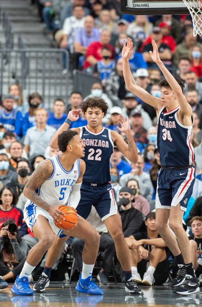 Gonzaga's Anton Watson (22) and Chet Holmgren (34) protect the basket from Duke’s Paolo Banchero (5) in the Continental Tire Challenge Friday, Nov. 26, 2021 at T-Mobile Arena in Las Vegas, Nevada. (Jesse Tinsley/The Spokesman-Review)